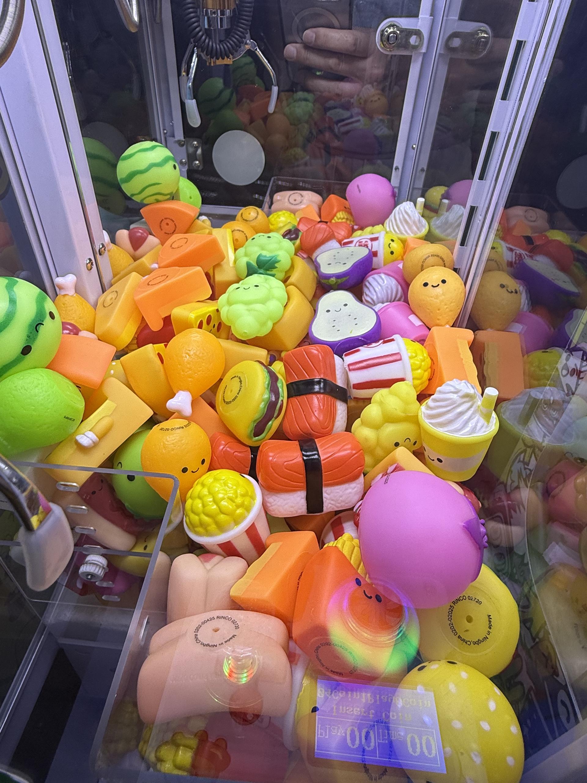 Mini claw machine with prize mix and bright cabinet wrap
