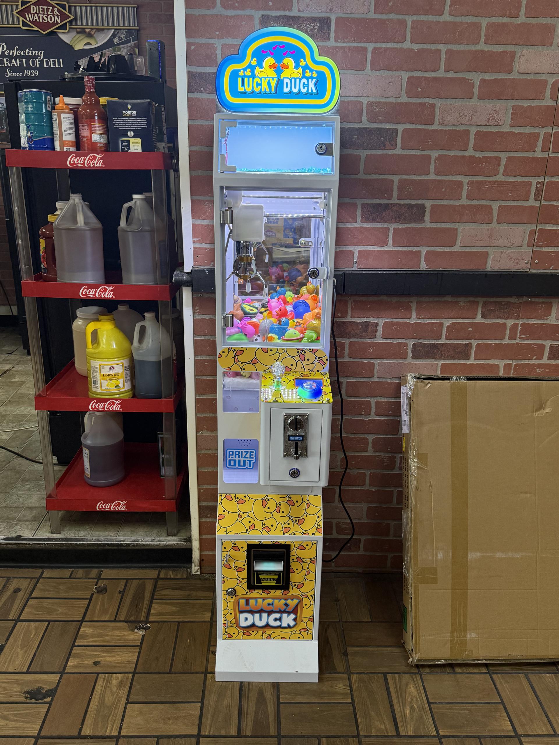 Candy and snack machine placement at a deli counter zone